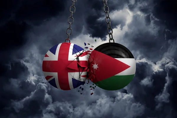 Birleşik Krallık ve Ürdün bayrağı siyasi toplar birbirlerine çarpıyor. — Stok fotoğraf