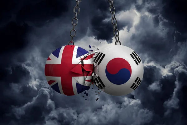 Reino Unido e Coreia do Sul bandeira bolas políticas esmagar em e — Fotografia de Stock