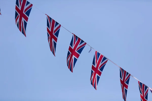 Union Jack flags hang in Windsor in preperation for the royal we — Stockfoto