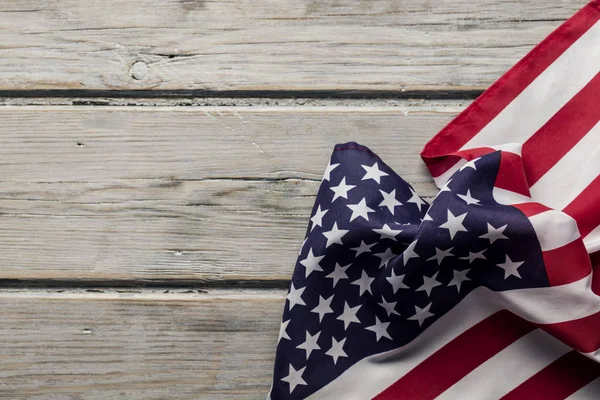 American stars and stripes flag on a white wooden plank backgrou