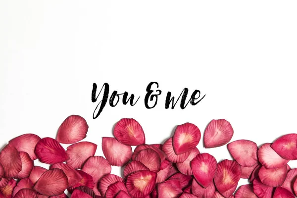 Red rose petals with you and me message — Stock Photo, Image