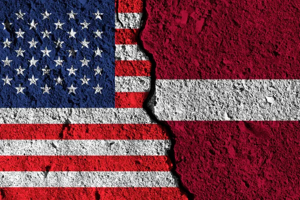 Crack between America and Latvia flags. political relationship c — Stock Photo, Image