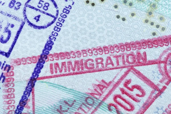 Immigration stamp in a passport — Stock Photo, Image