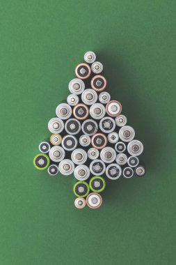 Festive christmas tree shape made from old batteries clipart