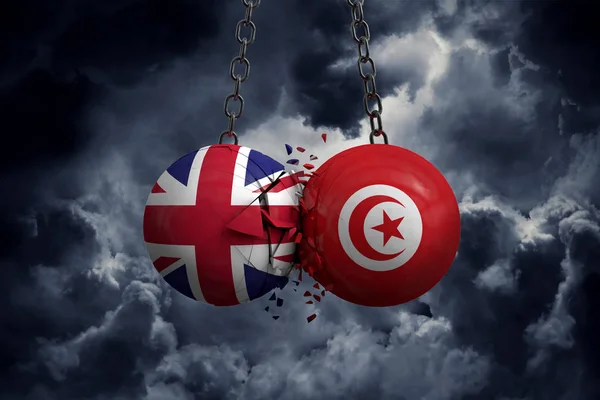 United Kingdom and Tunisia flag political balls smash into each — Stock Photo, Image