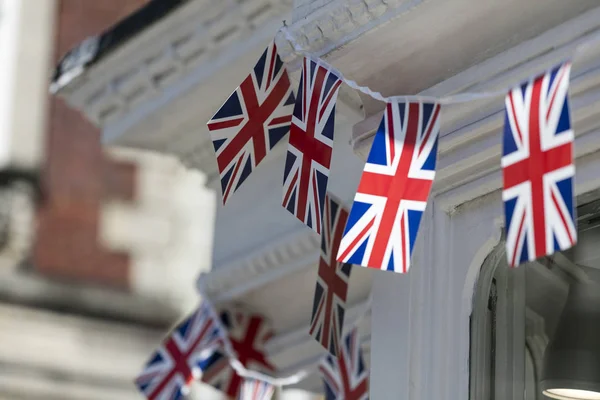 Union Jack flags hang in Windsor in preperation for the royal we — Stockfoto