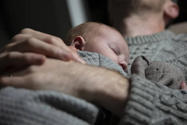 A father holding his baby son on his chest. Family bonding. Fatherhood — Stock Photo, Image