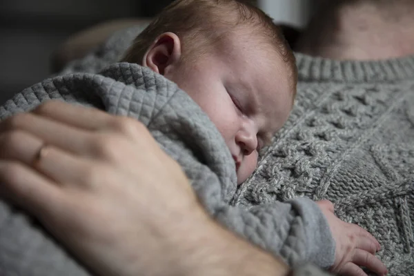 A father holding his baby son on his chest. Family bonding. Fatherhood — Stock Photo, Image