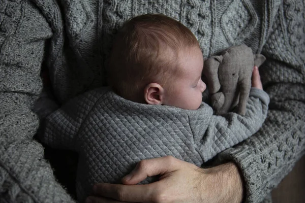 A father holding his baby son on his chest. Family bonding. Fatherhood — Stock Photo, Image