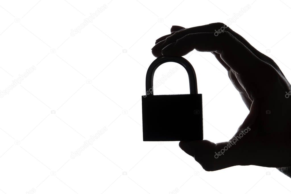 Silhouette of a hand holding a padlock on a plain white backgrou