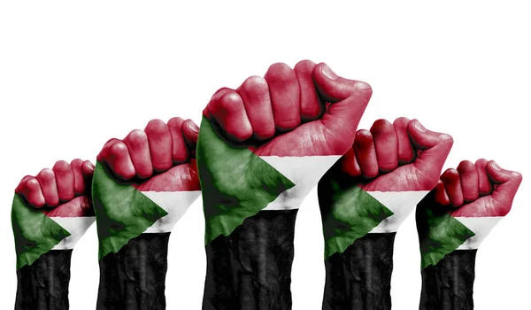 A raised fist of a protesters painted with the Sudan flag — Stock Photo, Image