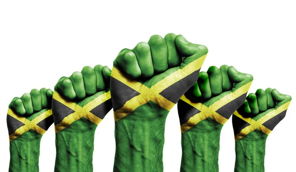 Egy tüntető felemelt ökle a Jamaica zászlóval festve. — Stock Fotó
