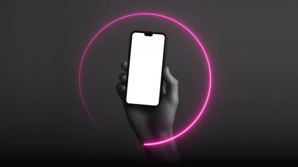 Hand holding modern smartphone with a blank white screen and neon light glow — Stock Footage Hand holding modern smartphone with a blank white screen and neon light glow Stock Footage