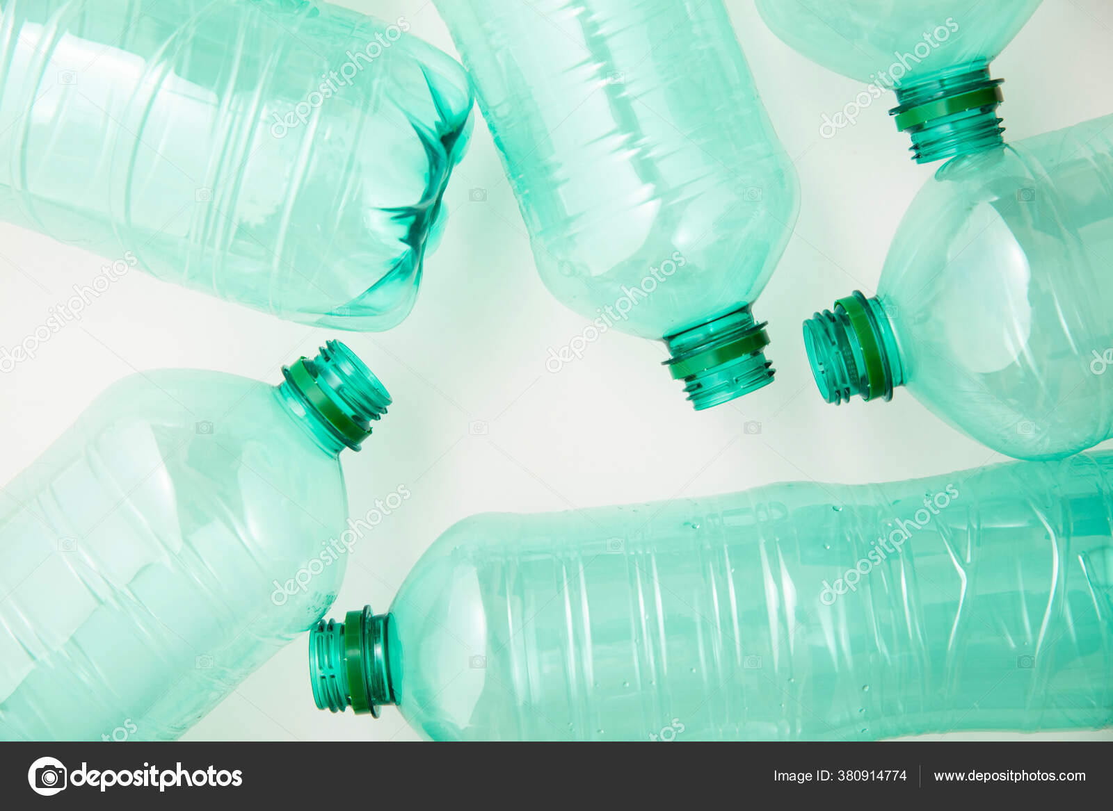 Empty used green plastic water bottles for environment
