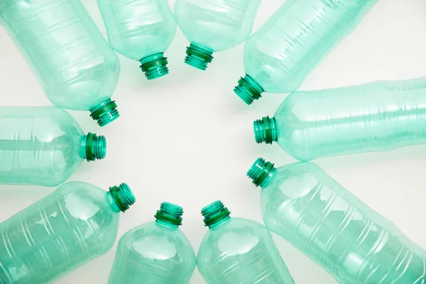 Empty used green plastic water bottles for recycling. environment concept