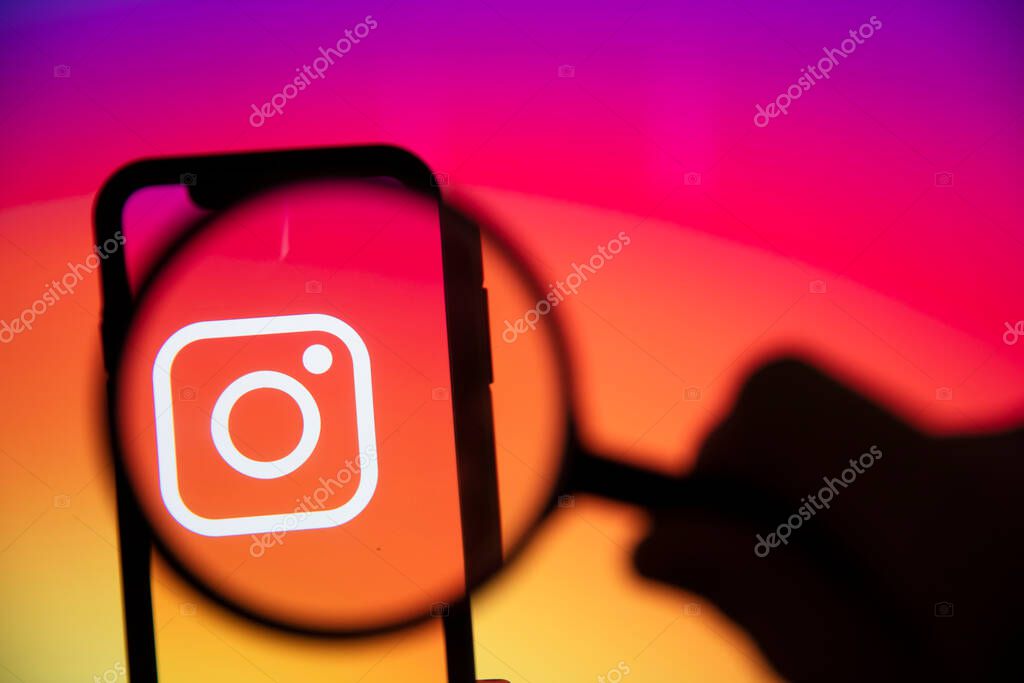 LONDON, UK - June 2020: Instagram logo under a magnifying glass on a smartphone
