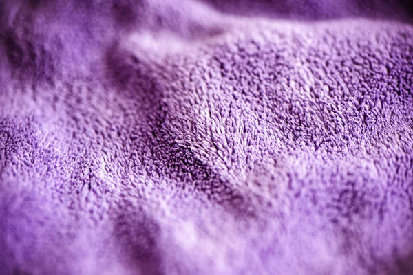Lilac delicate soft background of fur plush smooth fabric. Textu