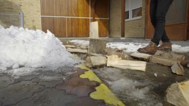 Man Chopping Wood Snow Yard Winter Village — Stock Video