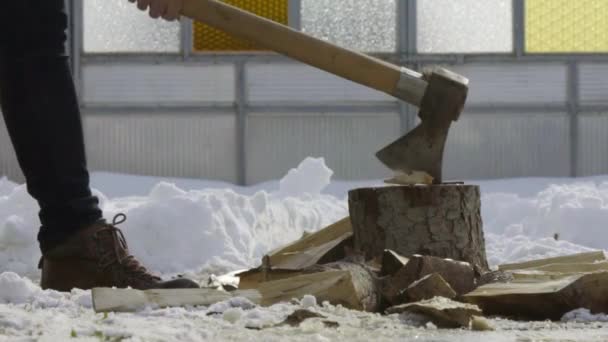 Man Chopping Wood Snow Yard Winter Village Slow Motion — Stock Video