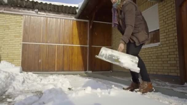 Man Cleaning Shovelling Fresh Snow Yard — Stock Video