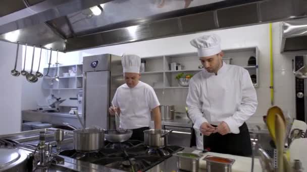 Chef Stirs Soup Saucepan Cooks Helping Making Salad — Stock Video
