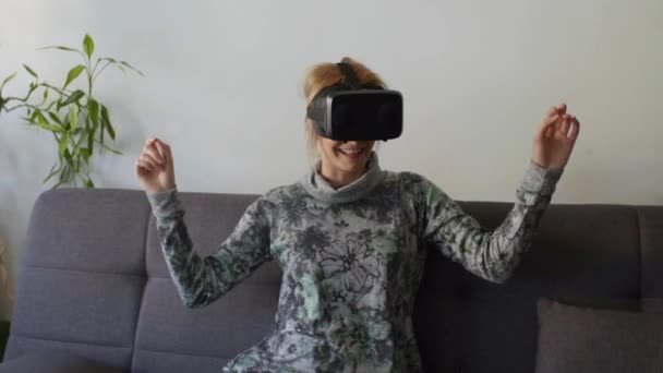 Woman Home Enjoying Virtual Reality Goggles Sofalooking Using Gestures Hands — Stock Video