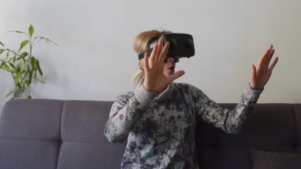 Woman Home Enjoying Virtual Reality Goggles Sofalooking Using Gestures Hands — Stock Video