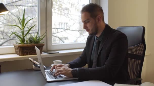 Businessman Drinking Coffee Working Laptop Office Taking Notesby Window Black — Stock Video