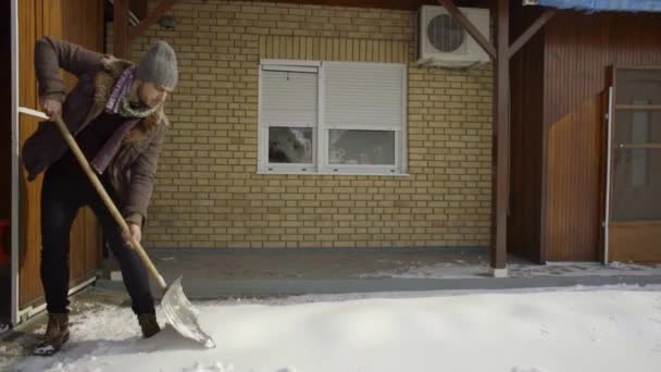 Man Cleaning Shoveling Fresh Snow Yard Slow Motion — Stock Video