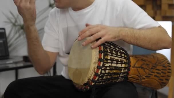 Professional Musician Having Wrist Pain While Playing Djembe Music Instrument — Stock Video
