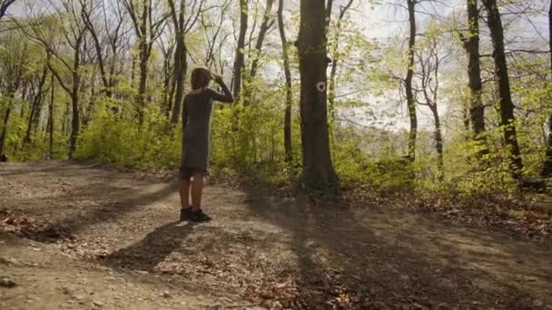 Young Attractive Woman Gray Dress Walking Trough Thick Forest Learning — Αρχείο Βίντεο