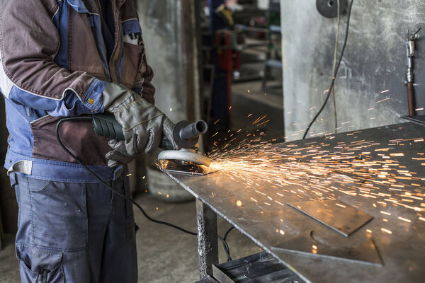 Grinding of materials in metallurgy workshop