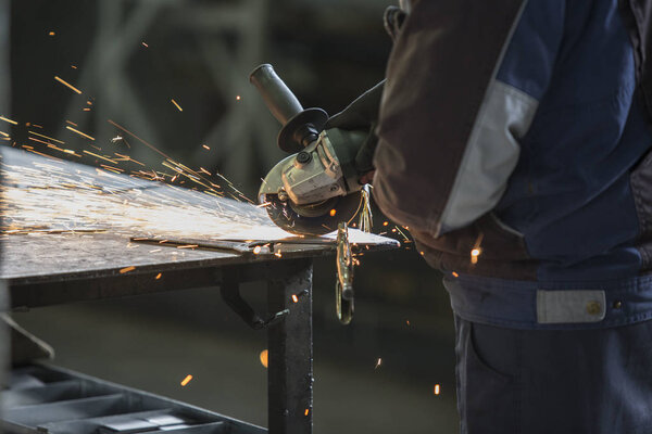 Grinding of materials in metallurgy workshop