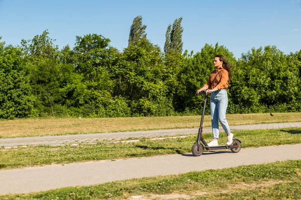 Young Beautiful Girl Rides Electric Scooter Park Green Surroundings Some — Stock Photo, Image