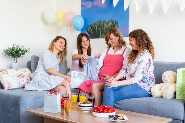 Group Smiling Friends Sitting Celebrating Baby Shower Opening Presents Atmospheric — Stock Photo, Image