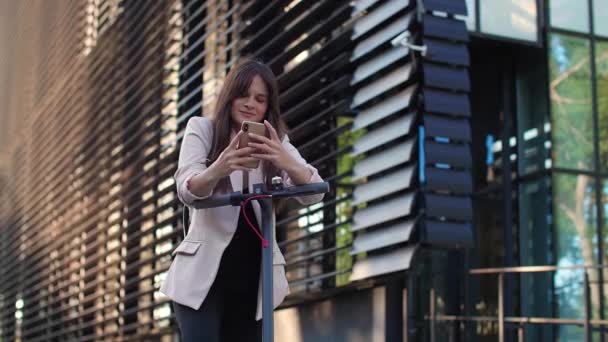 Young Beautiful Woman Standing Next Electric Scooter While Using Her — Stock Video