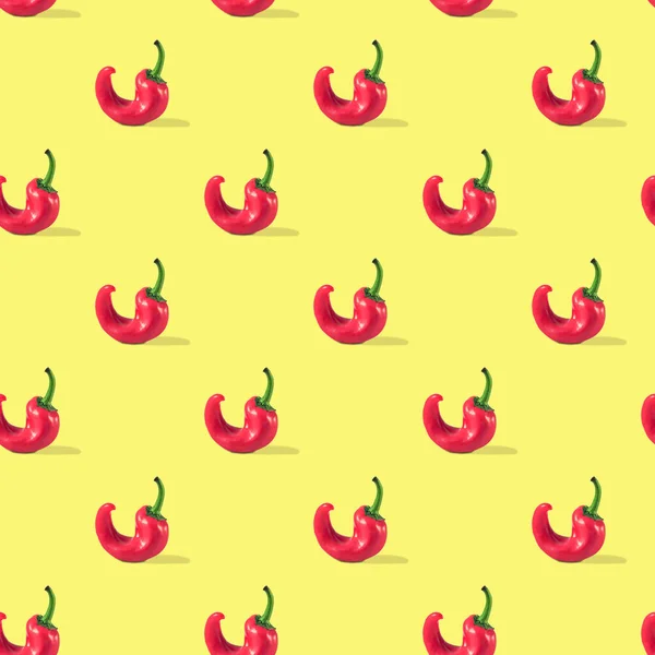 Ugly red pepper seamless pattern on yellow background