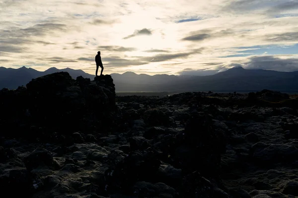 man on landscape of mars in a remote location of iceland
