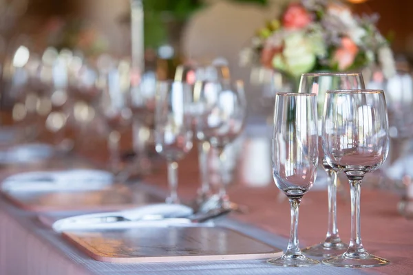 Wine and champagne glasses on decorated table — Stock Photo, Image