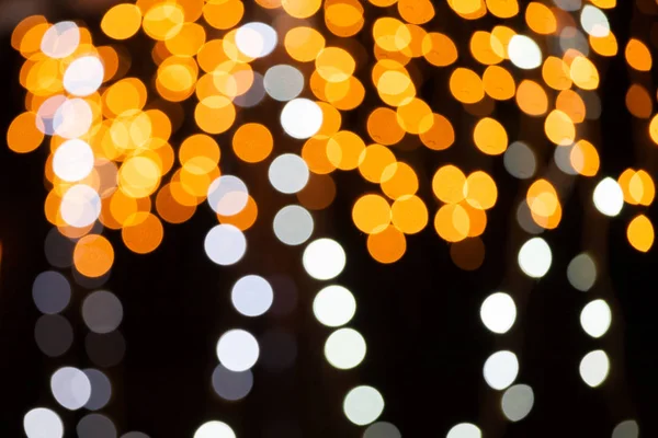 Fond sombre avec des lumières de fées floues Images De Stock Libres De Droits