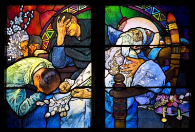 PRAGUE, CZECH REPUBLIC - MARCH 25 Close-up of the Art Nouveau stained glass window by Alfons Mucha, St. Vitus Cathedral, Prague on March 25, 2016. clipart
