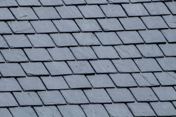 New slate roof, slate texture, perfect shape. Slating roof. Grey colors.