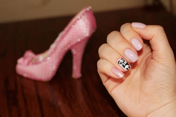 On the nails pink lacquer in the tone of the shoe, the figure on the nails is a sweet fluffy teddy bear. Modern Cinderella.