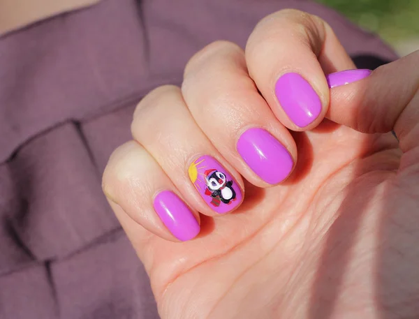 Funny penguin with a bell under the sun - drawing on the nails