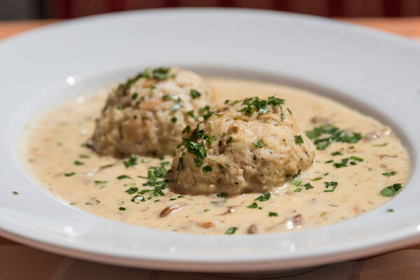 tasty chanterelle ragout with bread dumplings - closeup of wild mushrooms and sauce