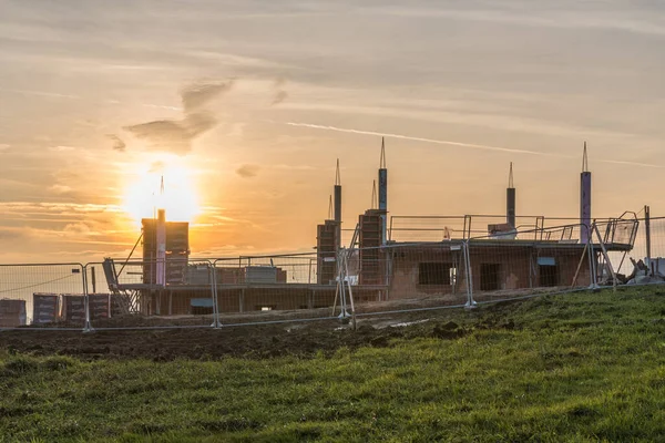 Atmospheric evening glow on a construction site - construction project