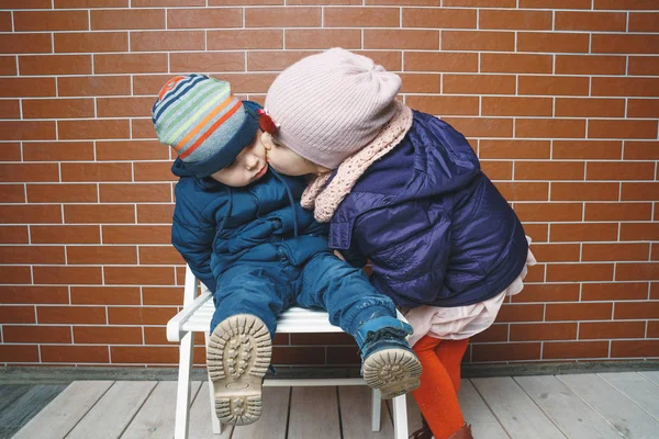 Sister Kissing Brother Sitting Chairs — Stock Photo, Image