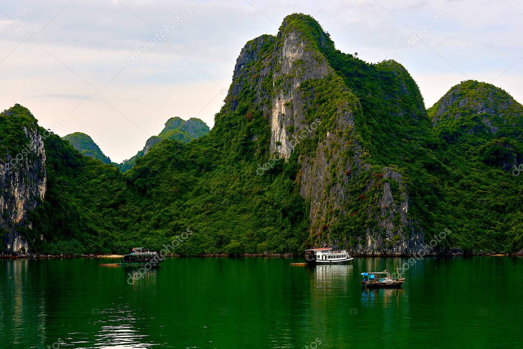 Halong bay boats, Vietnam Panoramic view of sunset in Halong Bay, Vietnam, Southeast Asia,UNESCO World Heritage Site