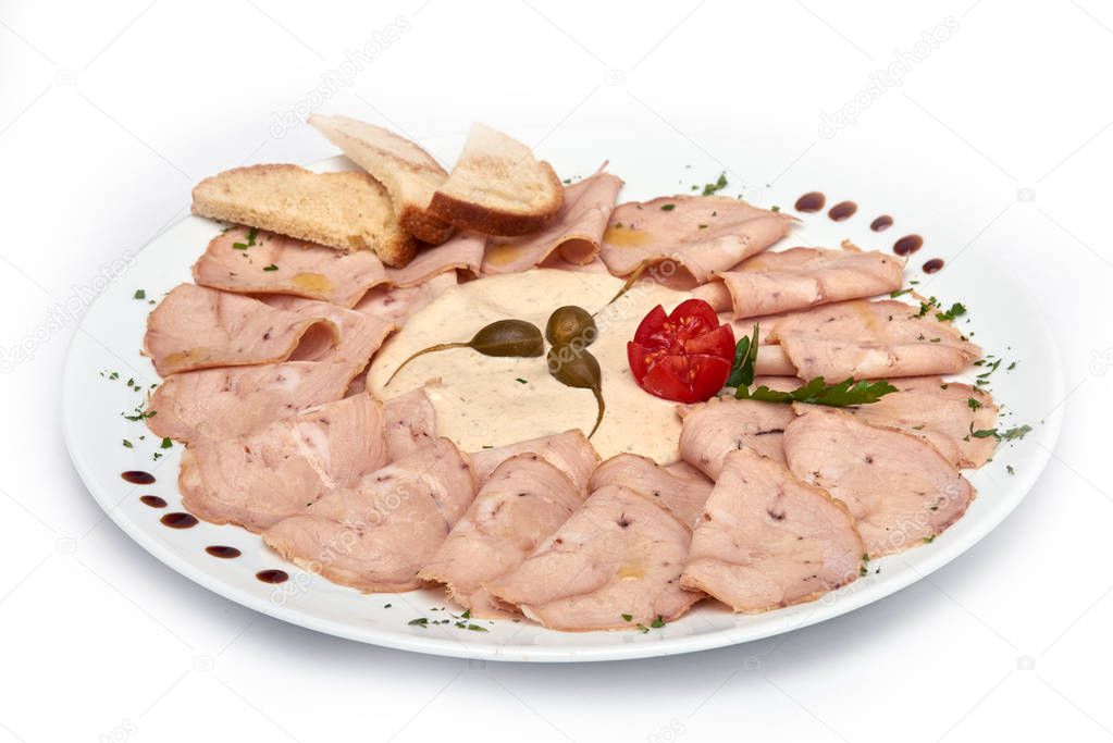 Vitello tonnato classic italian appertizer with veal and fish, served on white plate, isolated on white background