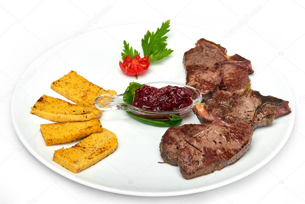 Italian food, Deer ribs with grilled polenta served on white plate, isolated on white background